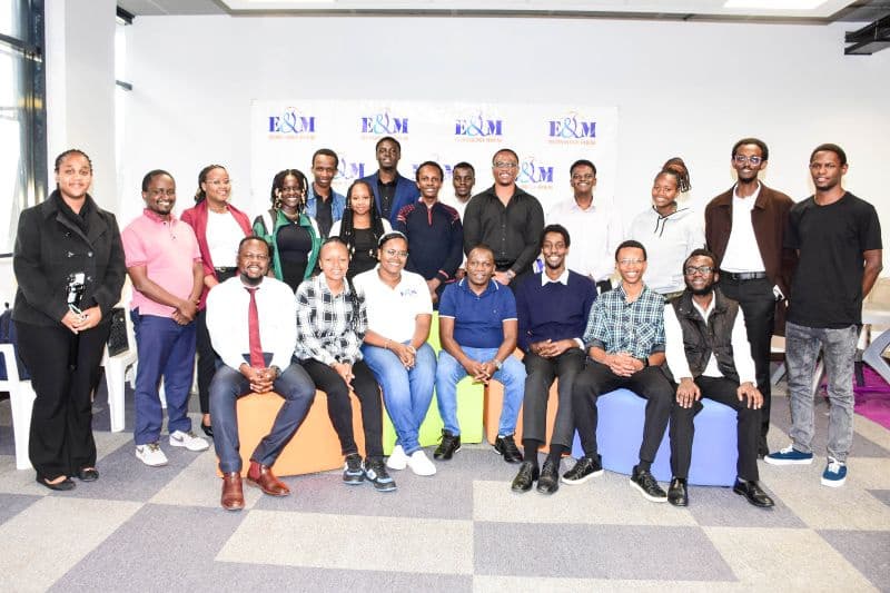 SCESA members posing as a group in front of an E&M Technology House backdrop